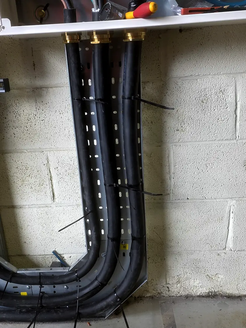 Cables formed down the wall to floor level