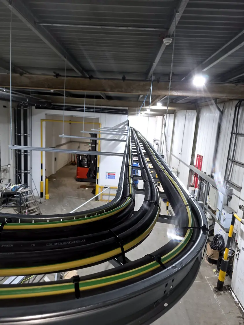 Ladder rack carrying large AC cables at high level