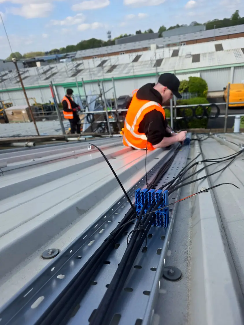 Terminating and dressing DC cables in the roof tray