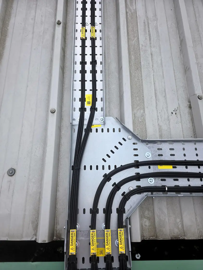 DC cable tray junction with labelled cables