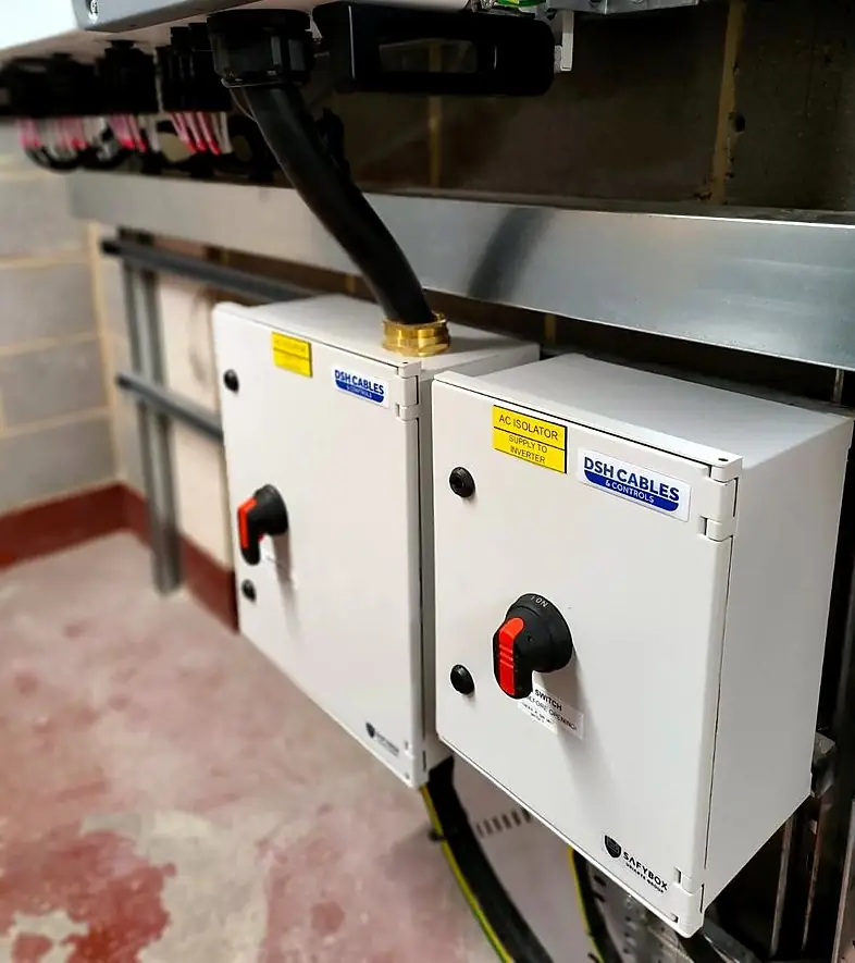 Two isolators mounted below an inverter